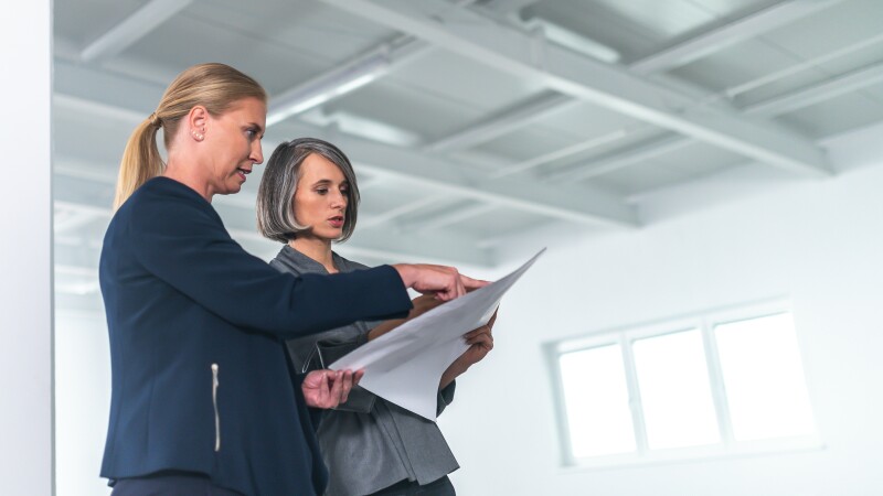 women surveying an office